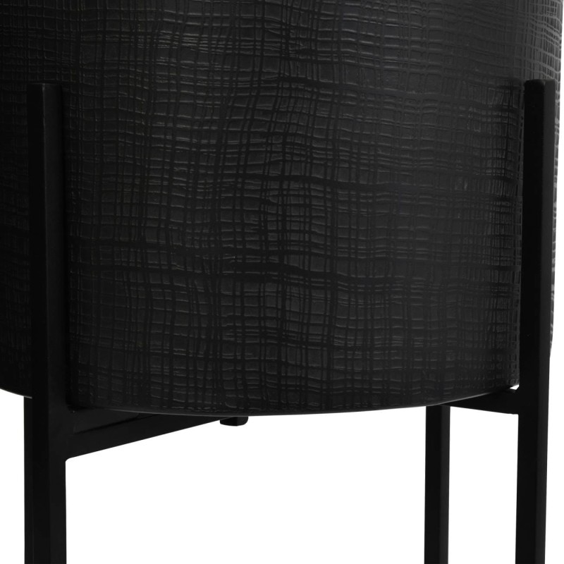 Black metal indoor plant pots on tall stands