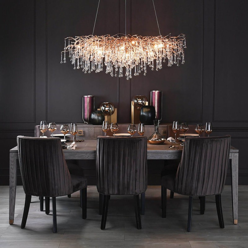 Large grey oak dining table with brass-coloured details