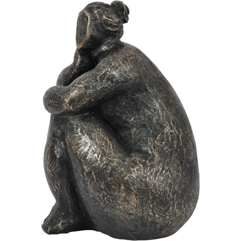 Contemplative seated woman figurine