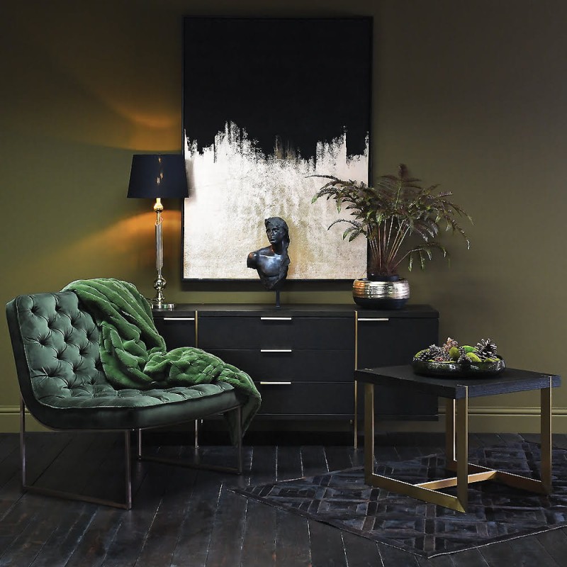 Large dark brown sideboard with gold frame in a living room