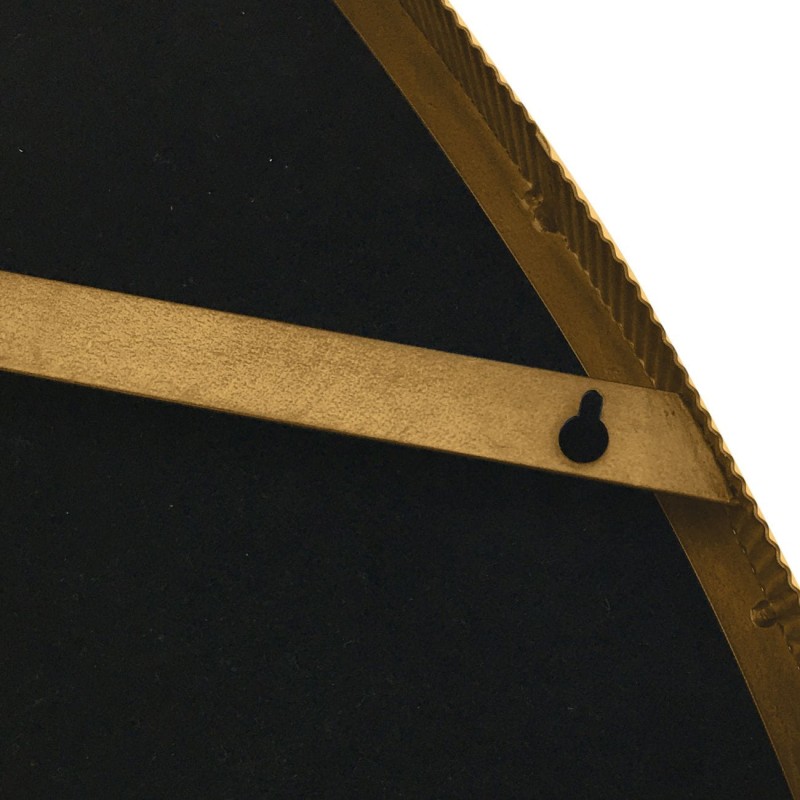 Asymmetric gold mirror for a modern classic interior