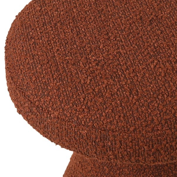 Upholstered rust bouclé stool with gold detail