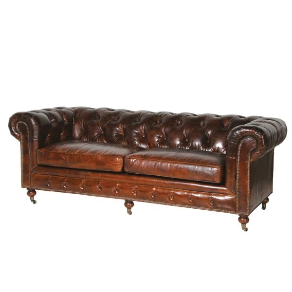 brown leather Chesterfield sofa with buttoned back and rolled arms