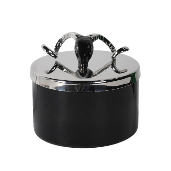Black candle with a silver ram’s head lid