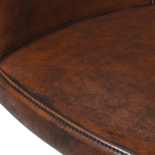 Brown faux leather office chair with black steel frame for a luxury home office