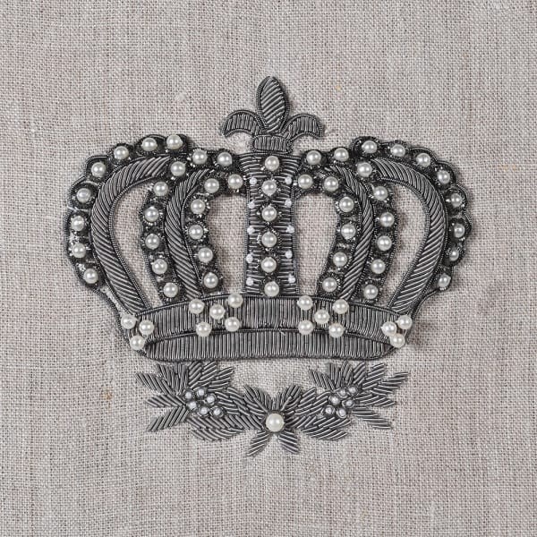 Beige linen cushion with hand-finished silver crown and feather filling