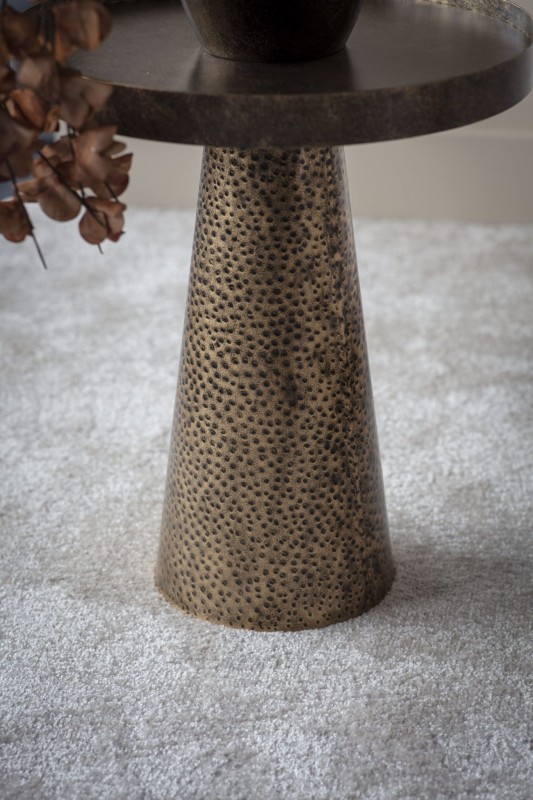 Round occasional table made from hammered iron