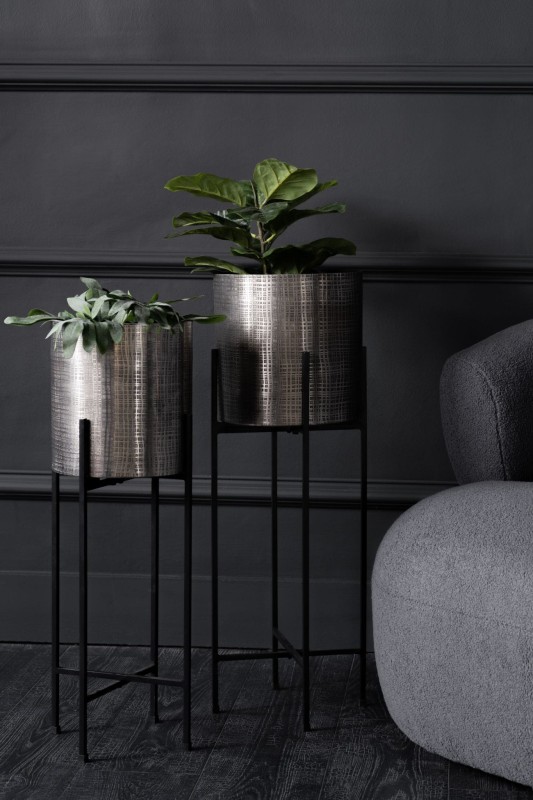 Silver planters on slim black metal stands