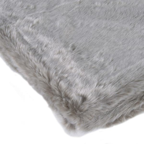 Luxury silver faux fur throw on an elegant bed 190 x 140 cm