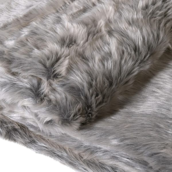 Luxury silver faux fur throw on an elegant bed 190 x 140 cm