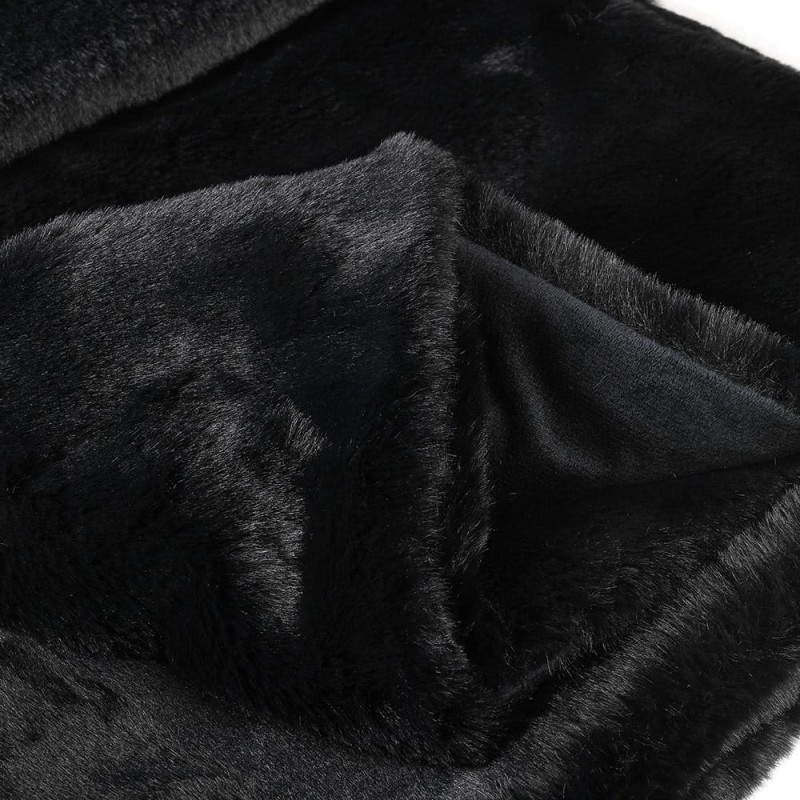 Luxury black faux fur throw for elegant bedroom interior