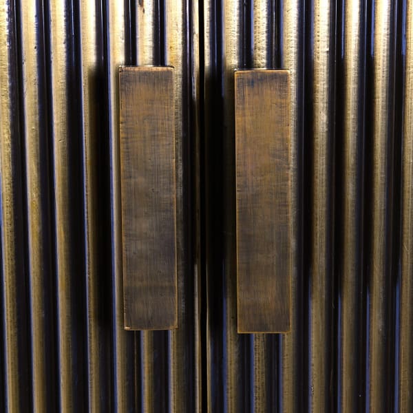 Fluted brass cabinet for an elegant living room