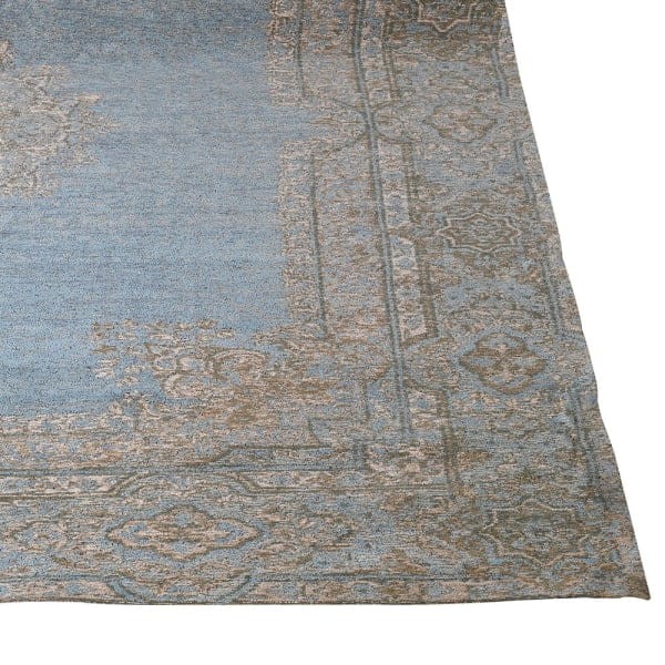 Large grey and blue area rug with a decorative woven pattern