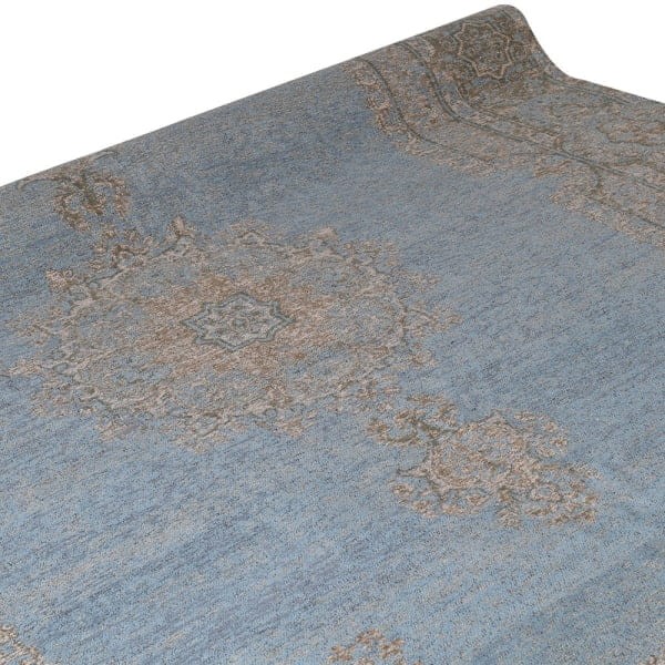 Large grey and blue area rug with a decorative woven pattern