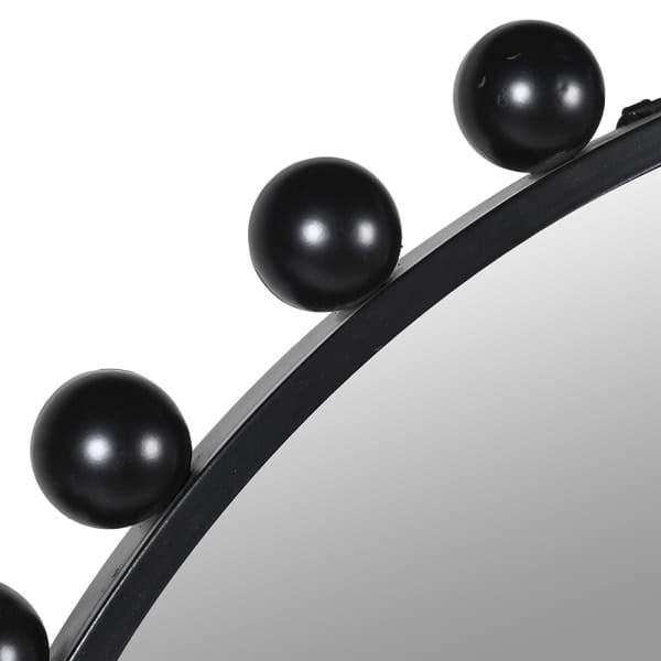 Close-up of the Bubble mirror’s glossy black iron sphere detailing