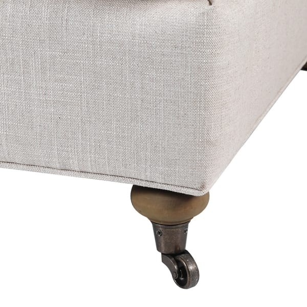 Light armchair with oak details and castor legs