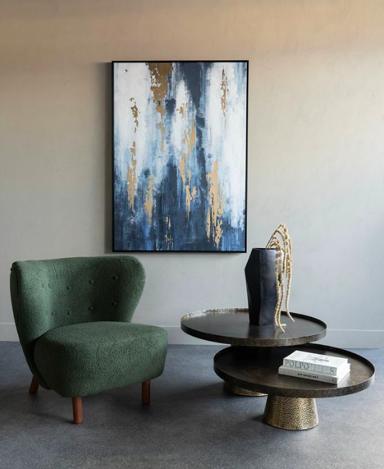 Two hammered iron tables arranged together