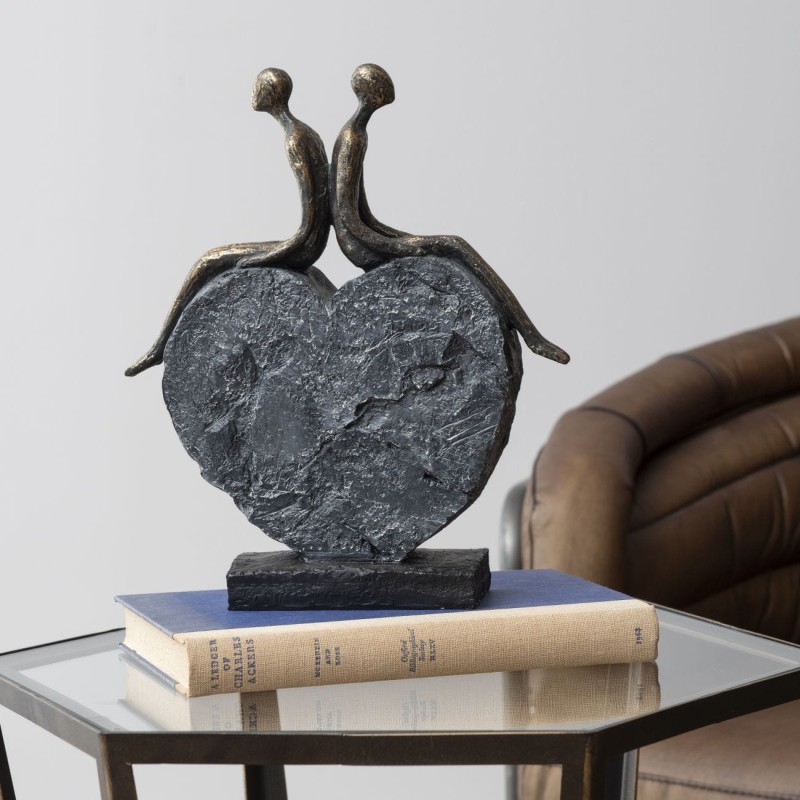 Couple seated on a heart-shaped base