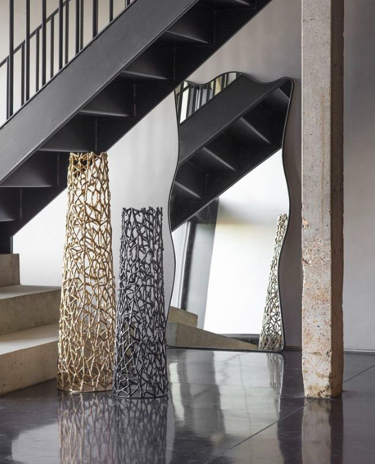 Tall openwork aluminium decorative vase