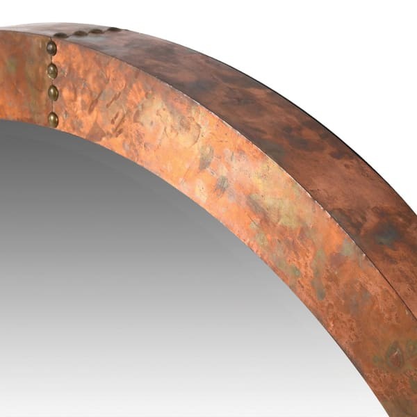 Large round aged copper-effect wall mirror measuring 91.5 cm