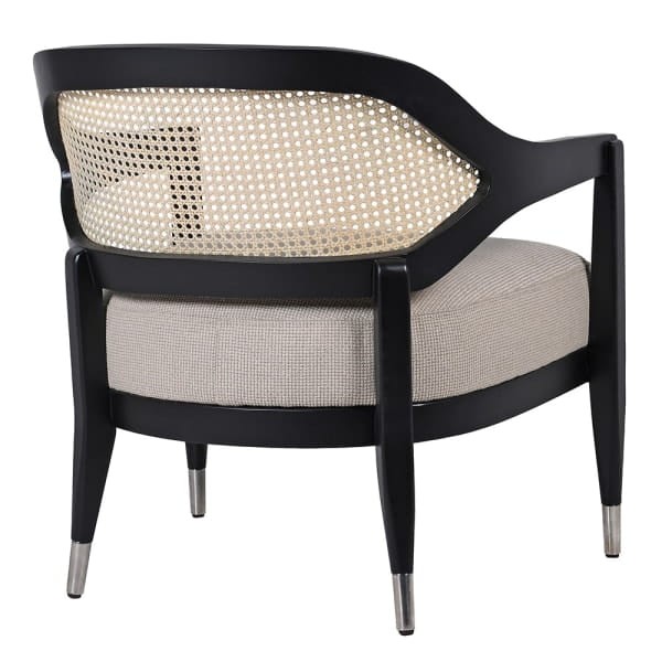 Black wooden armchair with natural rattan back