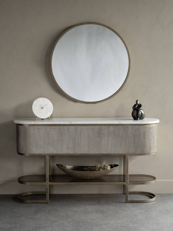 Round gold wall mirror for a living room
