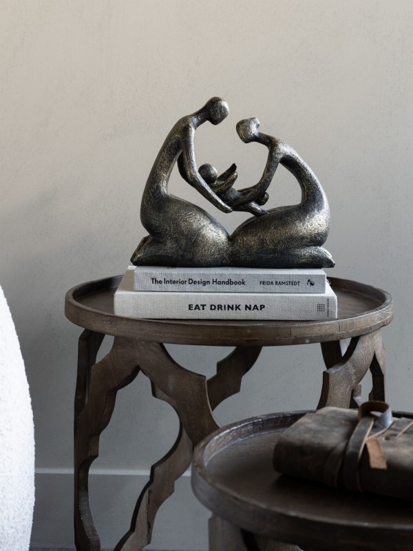 Antique bronze sculpture of a three-person family