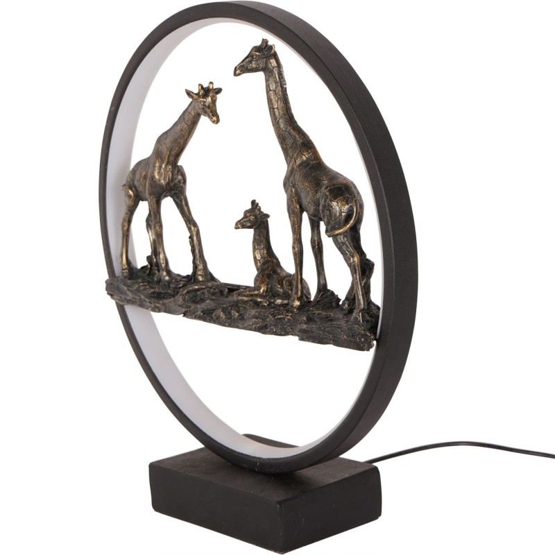 Illuminated sculpture featuring a family of giraffes