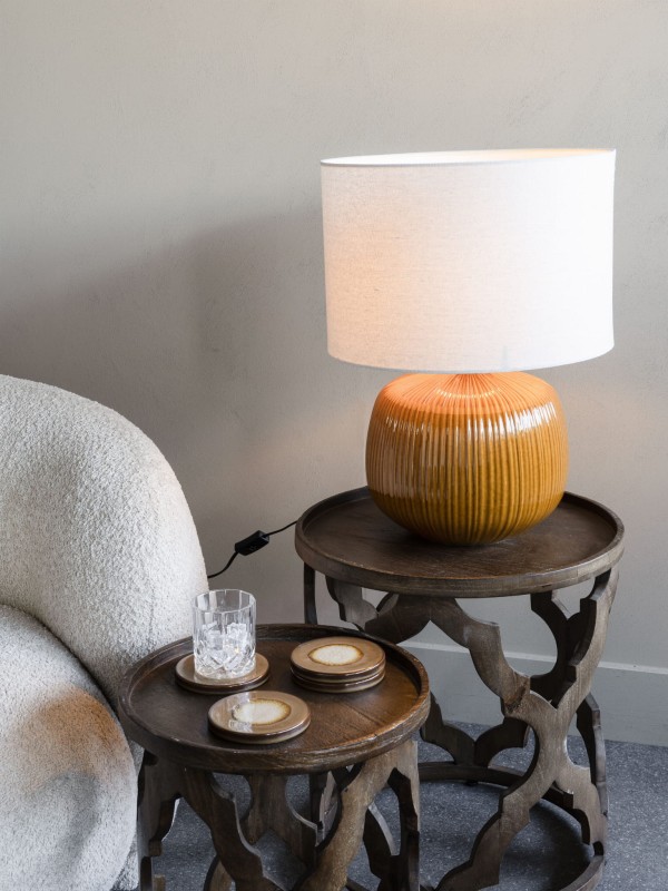 Orange ceramic table lamp with light linen shade