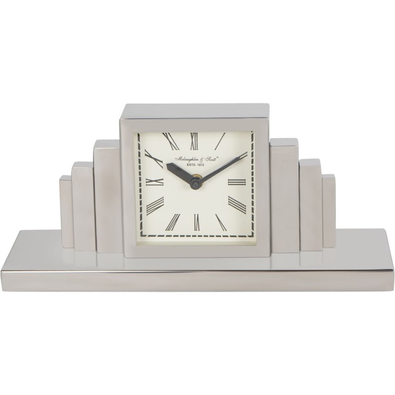 Silver mantel clock displayed on an elegant sideboard