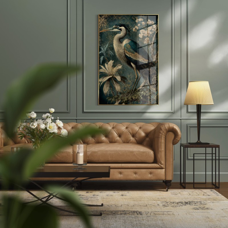 Heron glass wall art featuring a white heron on a deep green background in a gold frame