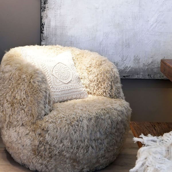 Lyall Round Swivel Armchair in Light Sheepskin Leather with Unique Seat Design