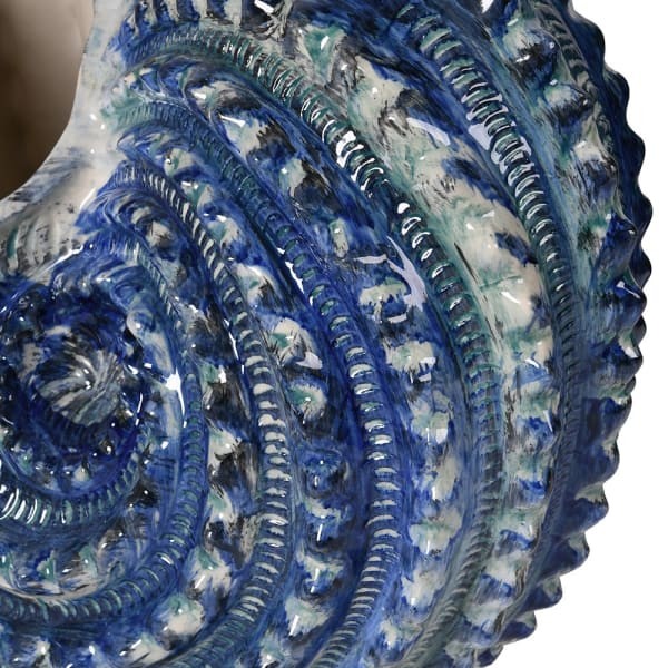 Large shell shaped ceramic vase in blue and white