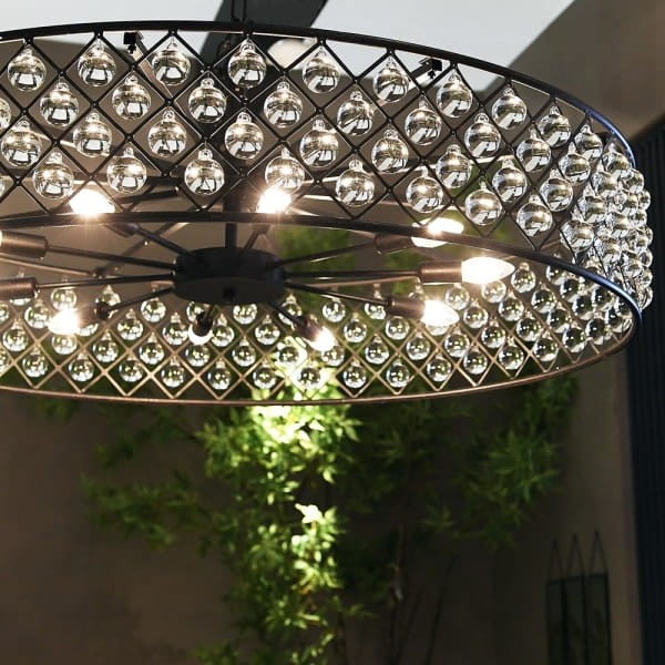 Black circular chandelier with glass globes for a modern dining room