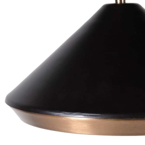 Black metal floor lamp with curved brass stem and conical shade