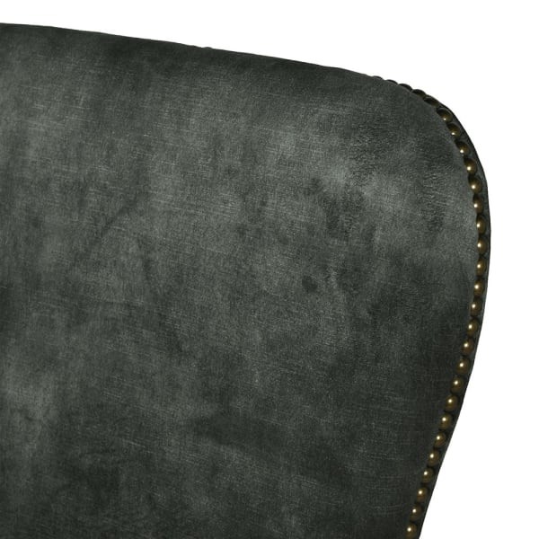 Emerald green velvet dining chair with oak legs