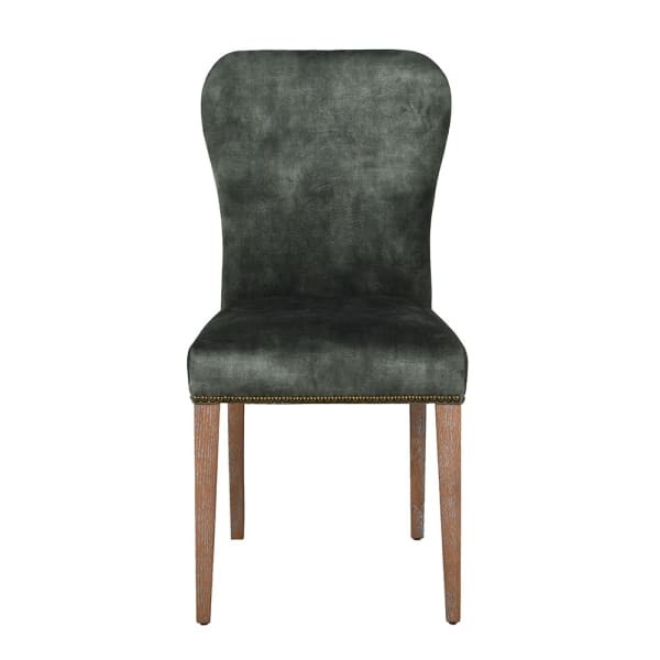 Emerald green velvet dining chair with oak legs
