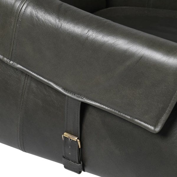 Dark grey vintage leather armchair with decorative buckle details