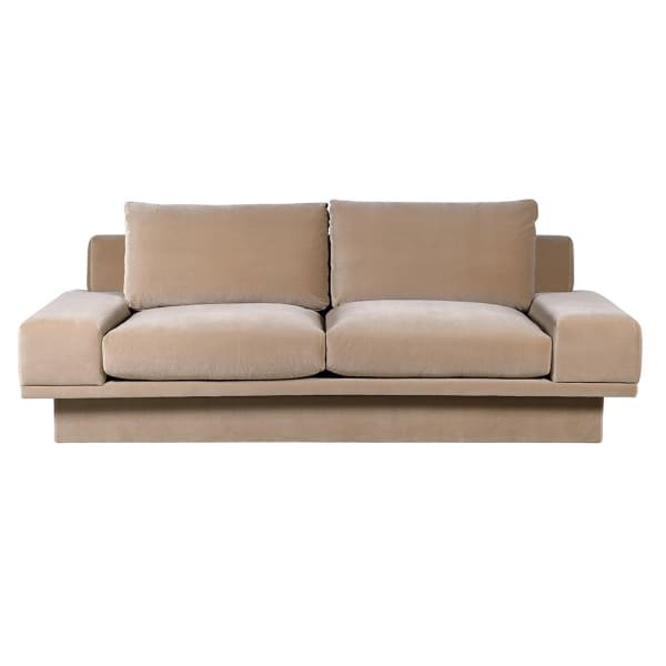 Large three-seater caramel velvet sofa for a modern living room