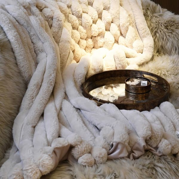 Luxury light grey faux fur throw for elegant bedroom interior