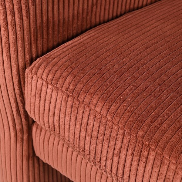 Designer orange velvet armchair for a contemporary living room