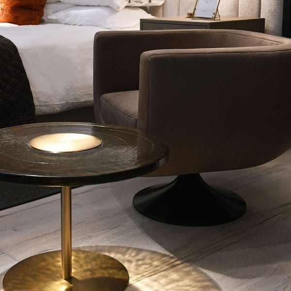 Amber round coffee table 61cm with a gold-toned frame