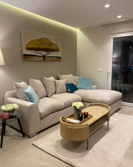Designer oval coffee table with slim gold metal legs