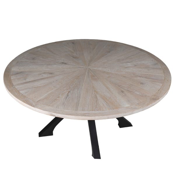 Round oak dining table with distressed wood top and black iron legs