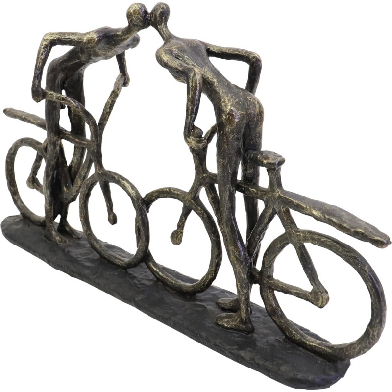 Decorative sculpture of two cyclists leaning towards each other