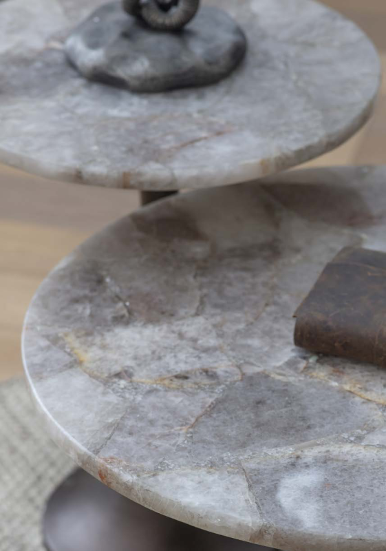 Round stone side table for an elegant living room