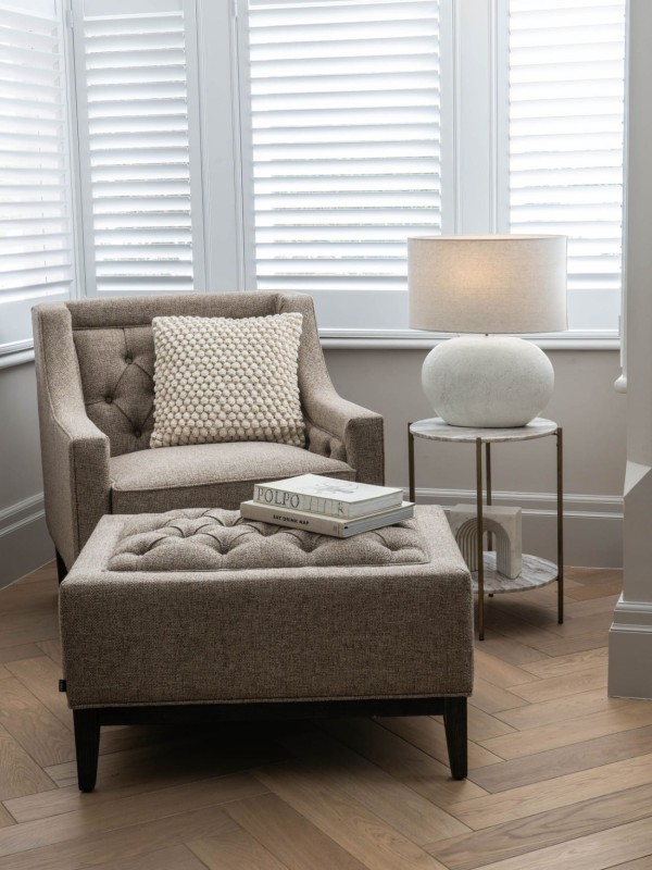 Beige-grey footstool with decorative buttons