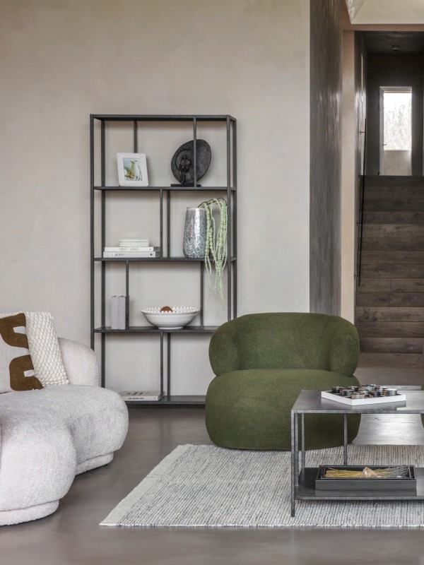 Tall black iron bookcase with open display shelves