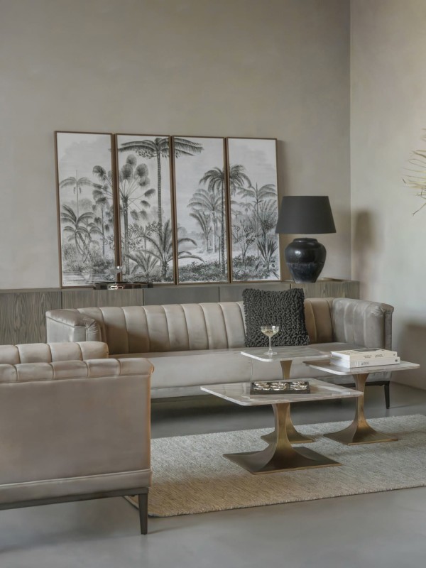 Pale marble side table beside a sofa or armchair