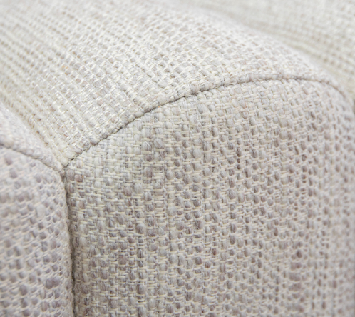 Cream upholstered bench with vertical channel detailing